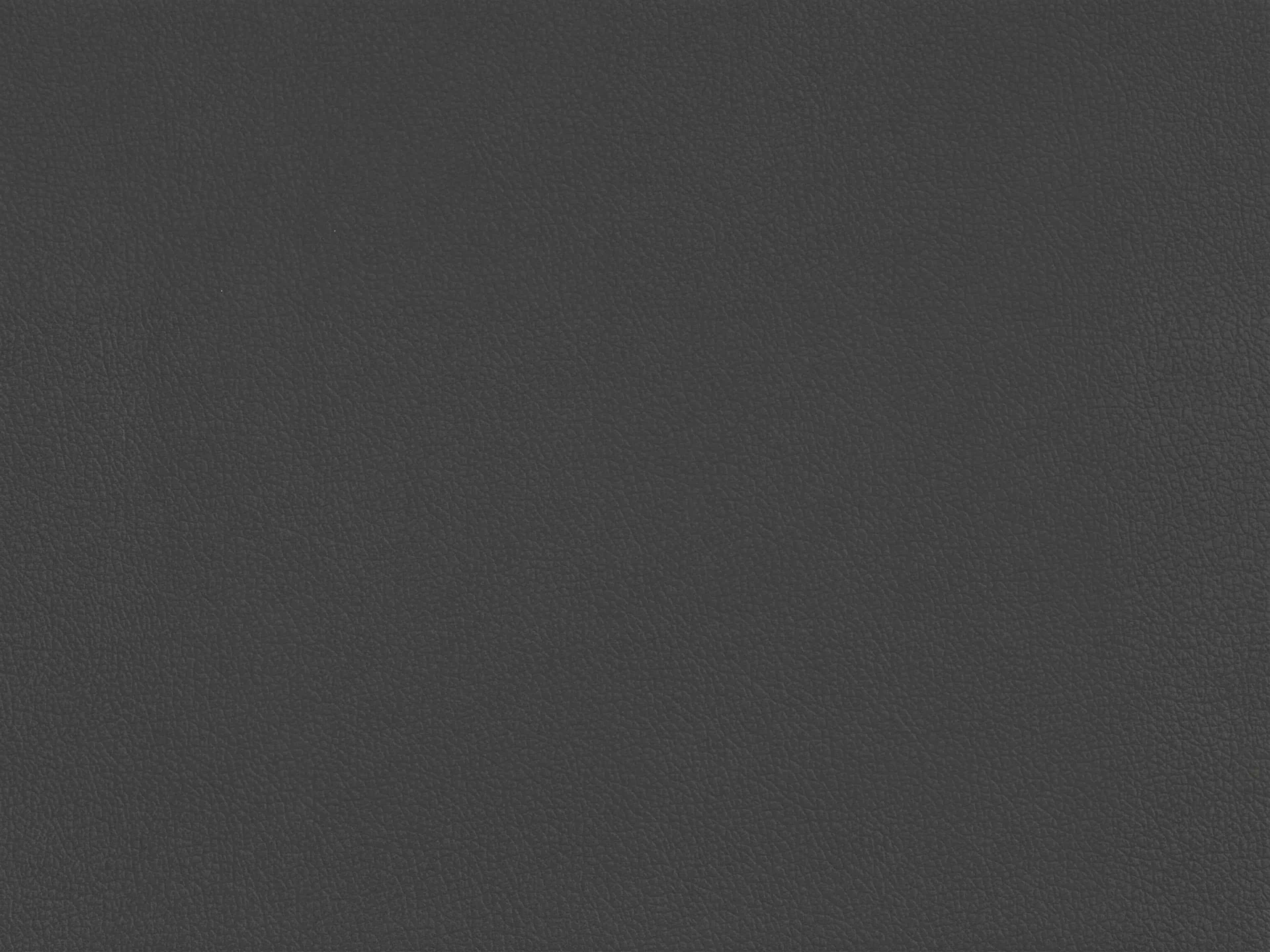 Dunkelgraue Lederoberfläche mit fein genarbter Struktur und matter Optik