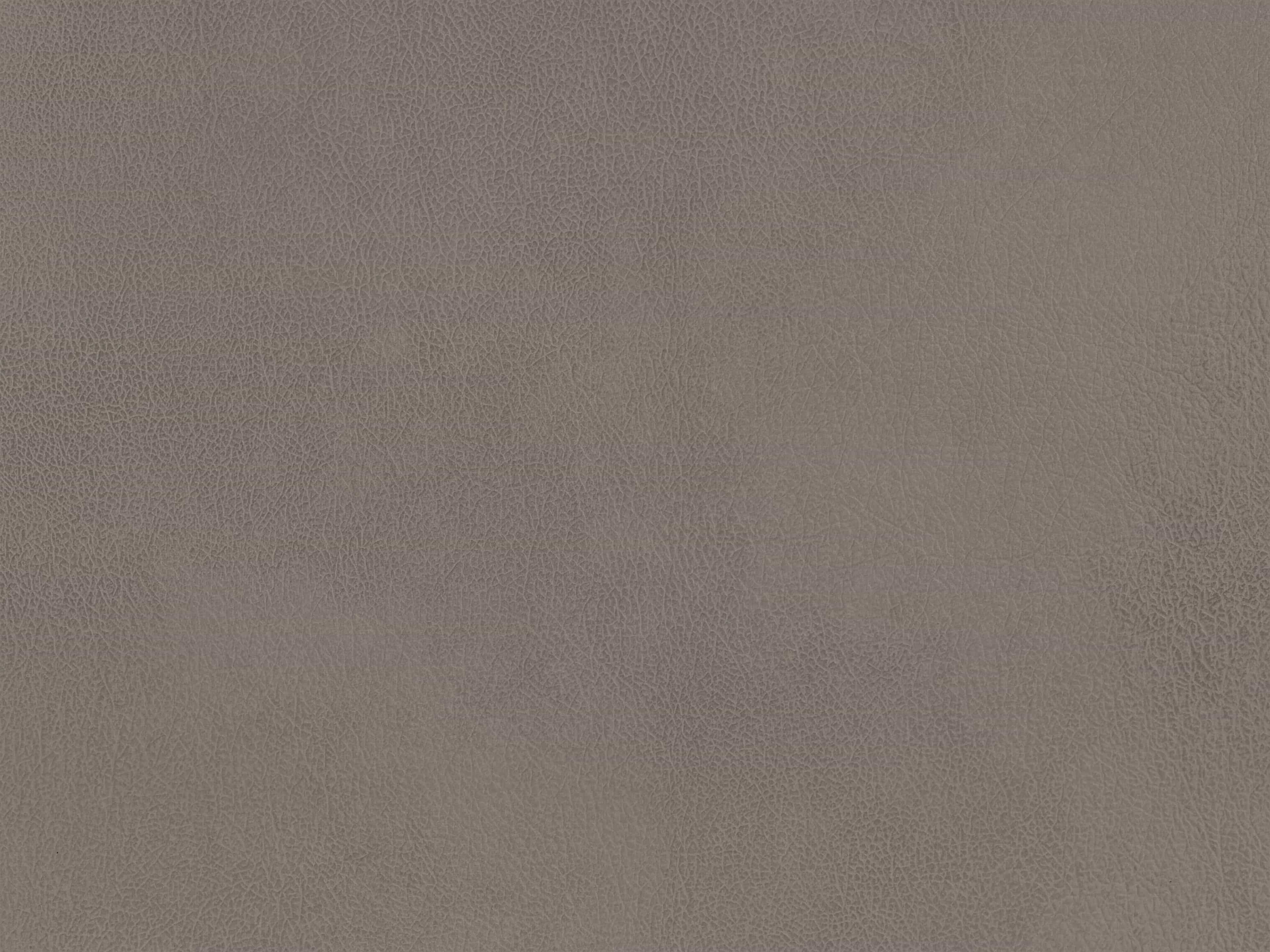 Nahaufnahme einer violetten Lederoberfläche mit feiner Narbung und natürlicher Struktur
