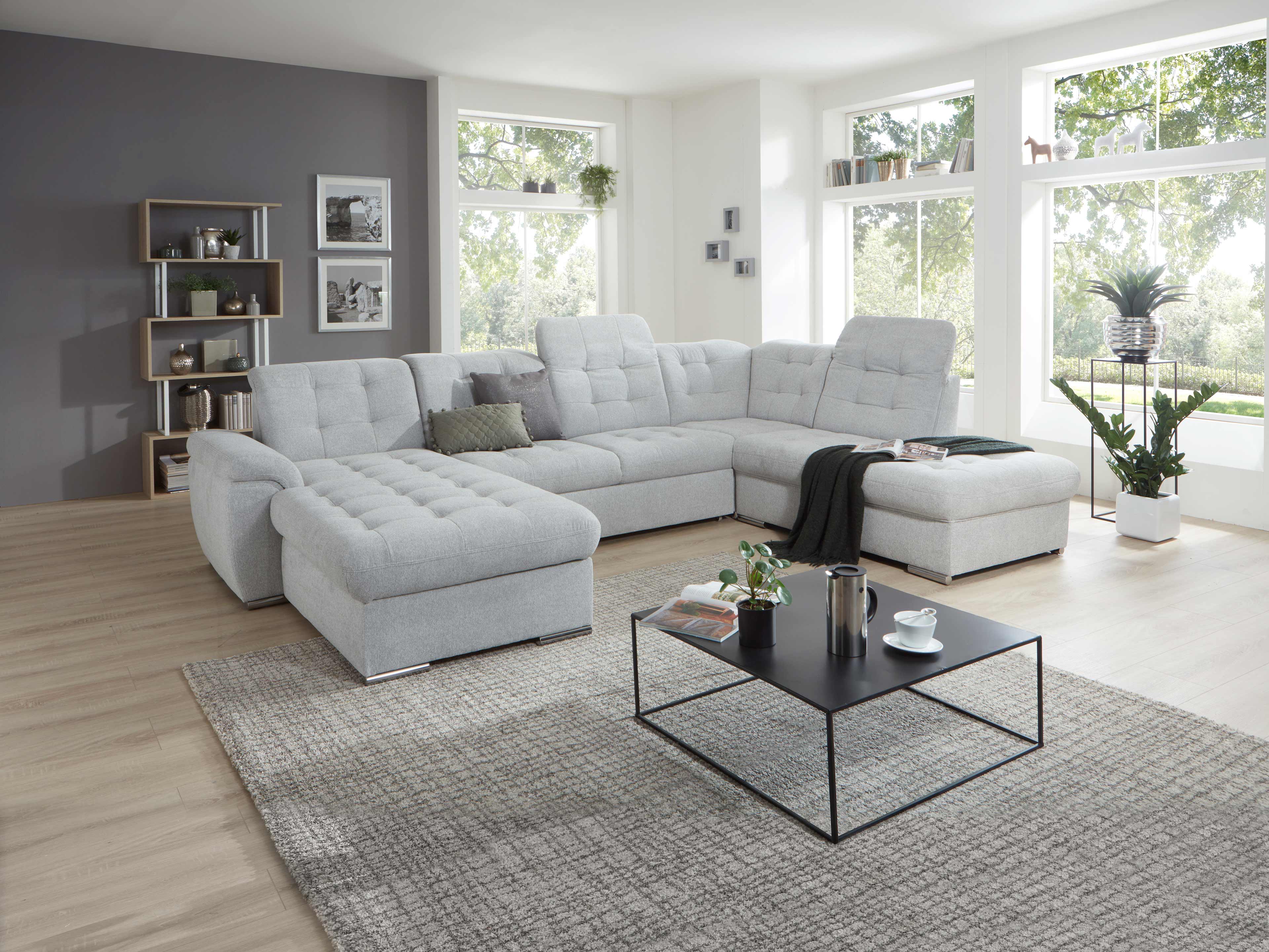 Ecksofa Kabs Polsterwelt mit grauem Stoffbezug, gepolsterten Rückenlehnen und Armlehne links