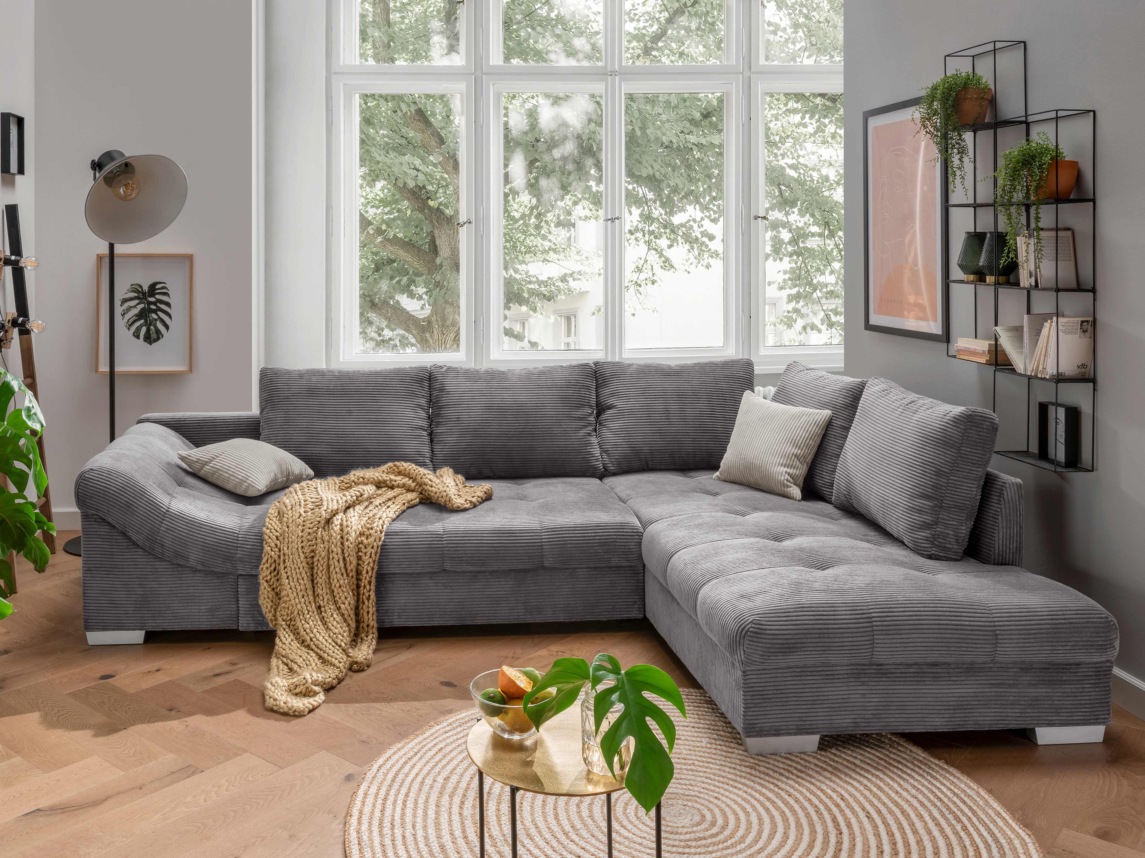 Ecksofa Kabs Polsterwelt mit grauem Cordbezug, breiten Armlehnen und großzügigen Rückenpolstern