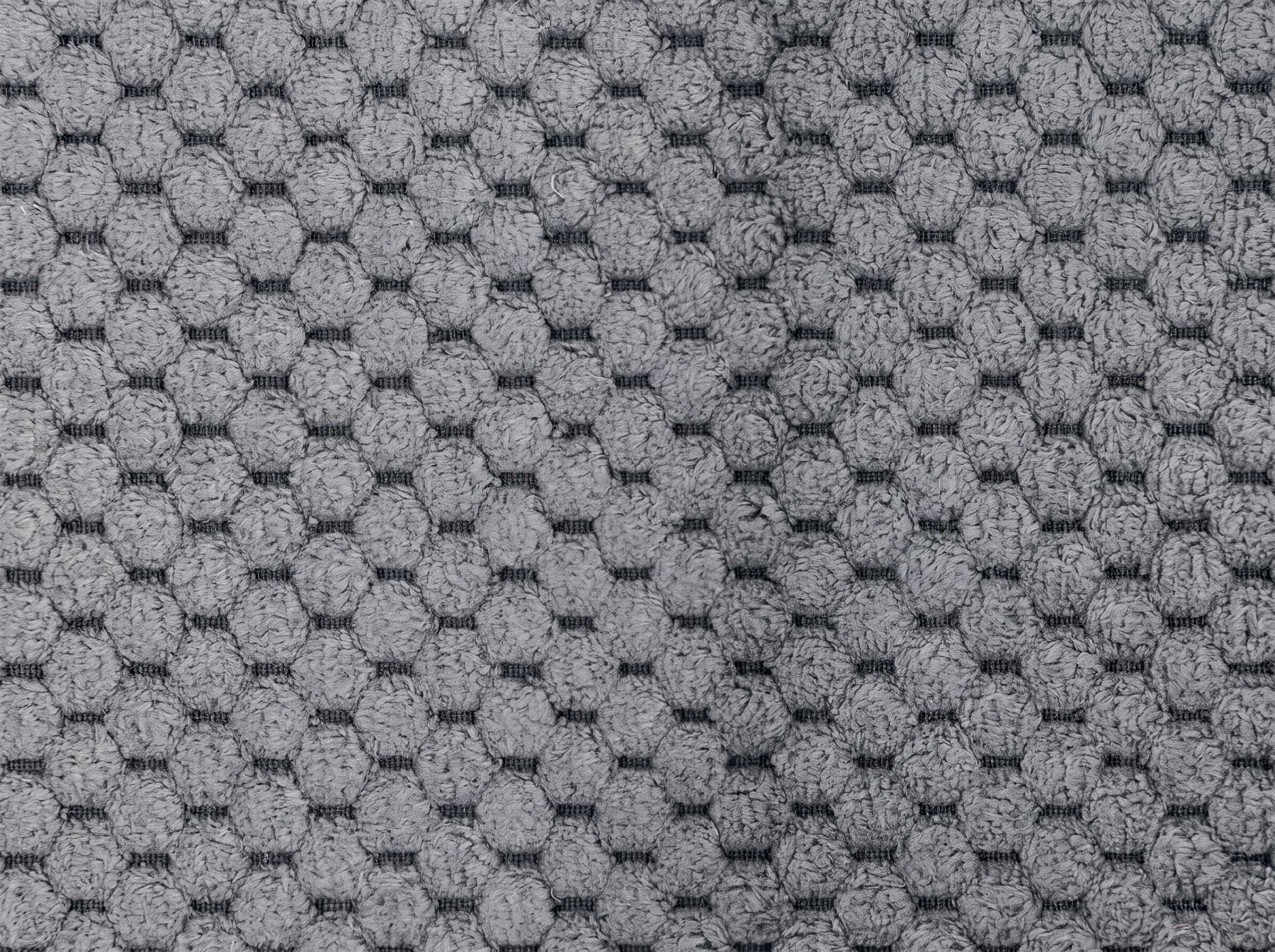 Strukturstoff in Grau mit wabenartigem, erhabenem Muster und klar sichtbarer, weicher Oberfläche