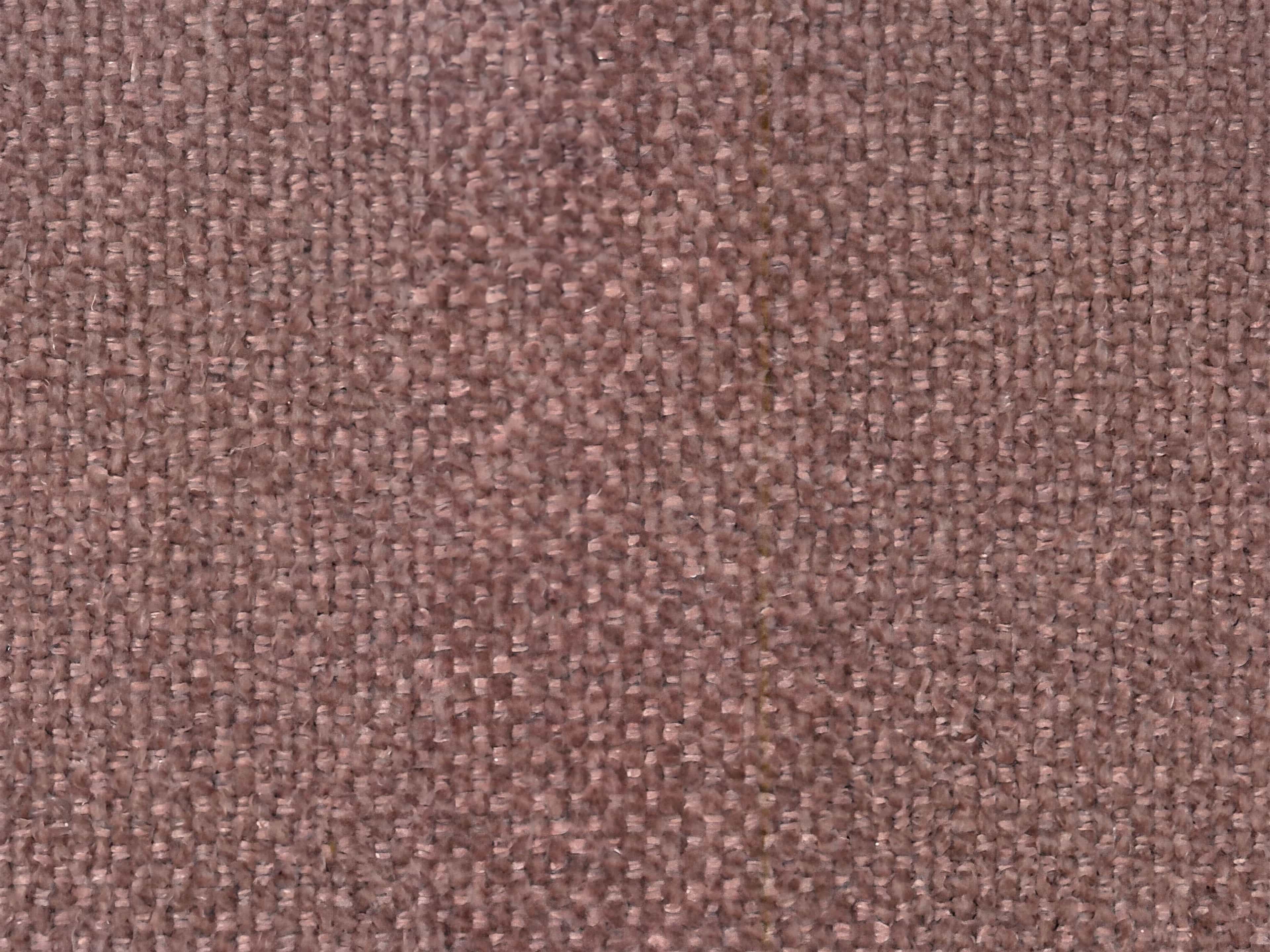 Nahaufnahme eines Bezugstoffs aus grob gewebtem Stoff in Rosa mit leicht strukturierter Oberfläche