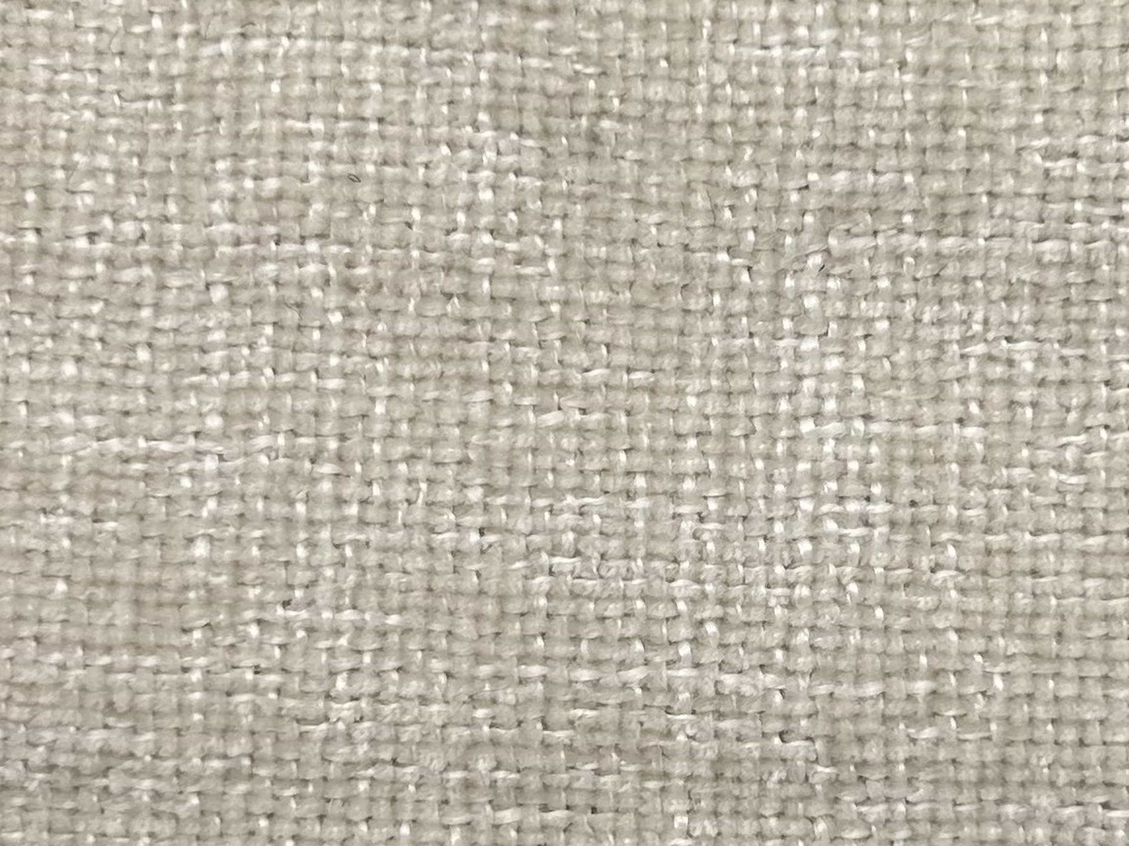 Strukturierter Stoffbezug in Beige mit sichtbarer grober Webstruktur und matter Oberfläche