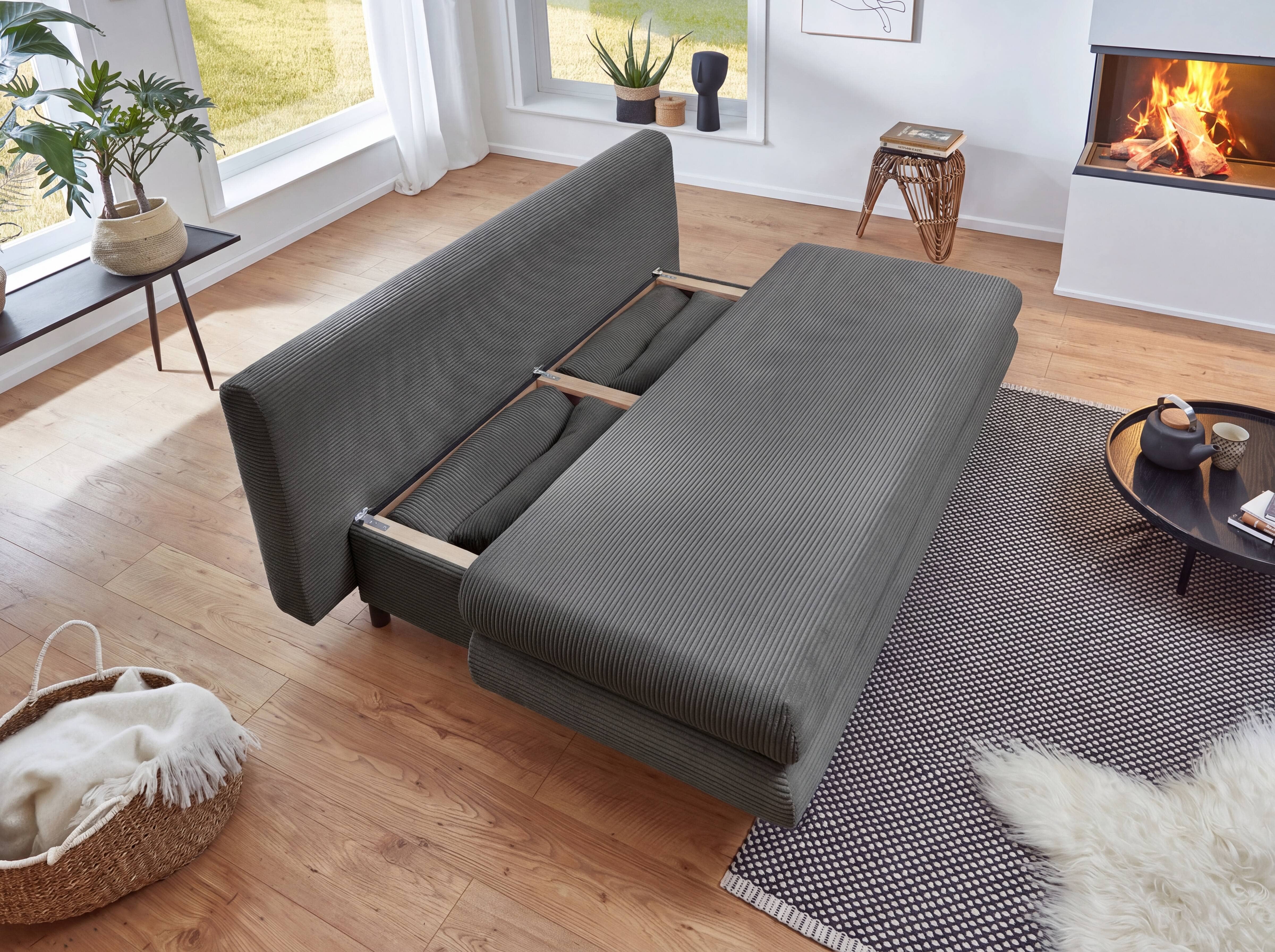 Schlafsofa Cordoba mit grauem Stoffbezug aus Cord, ausziehbar, seitliche Armlehnen, sichtbarer Holzrahmen