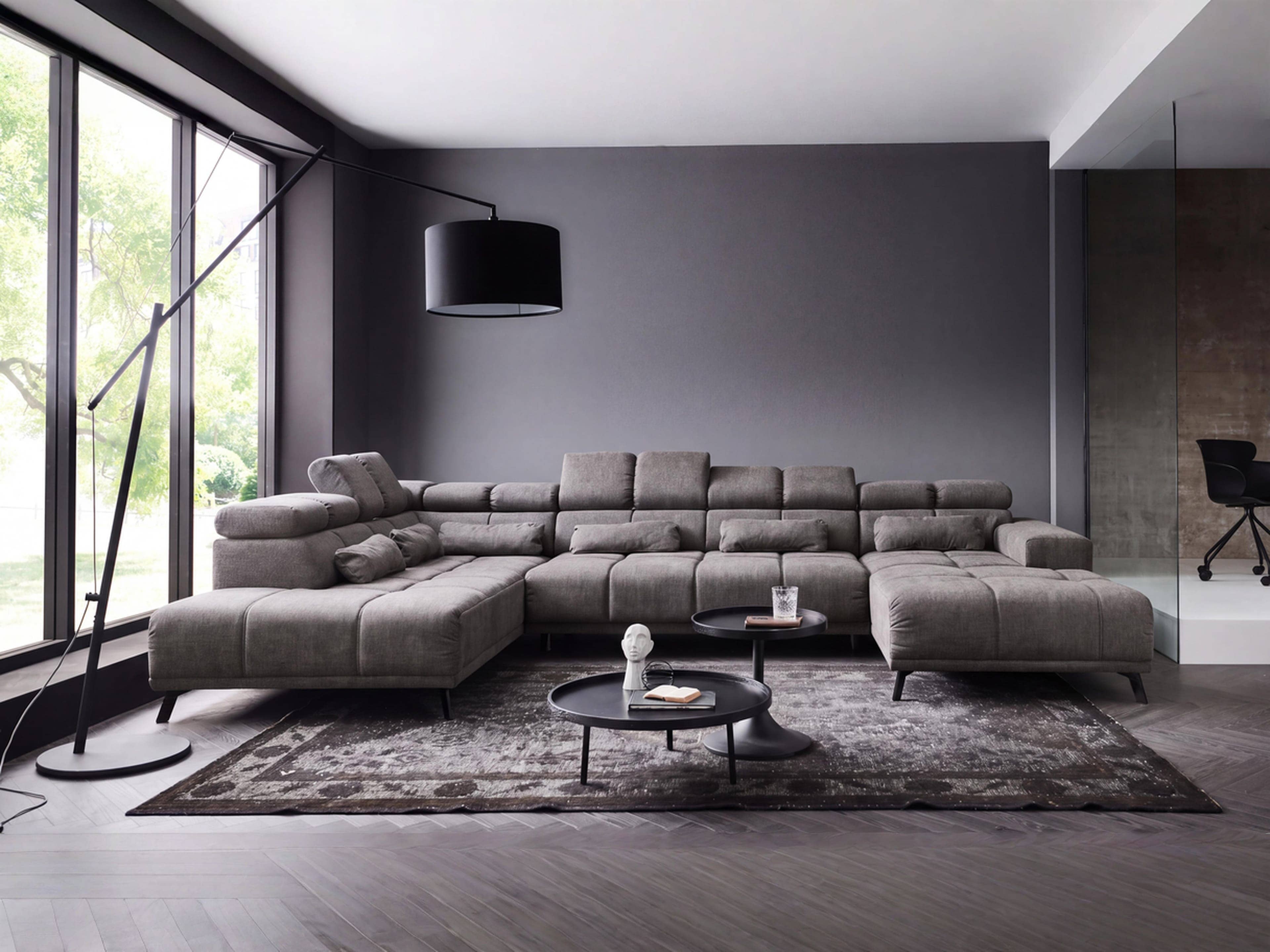 Ecksofa Kabs Polsterwelt aus grauem Stoff mit verstellbaren Kopfstützen, sichtbaren Nähten und Metallfüßen