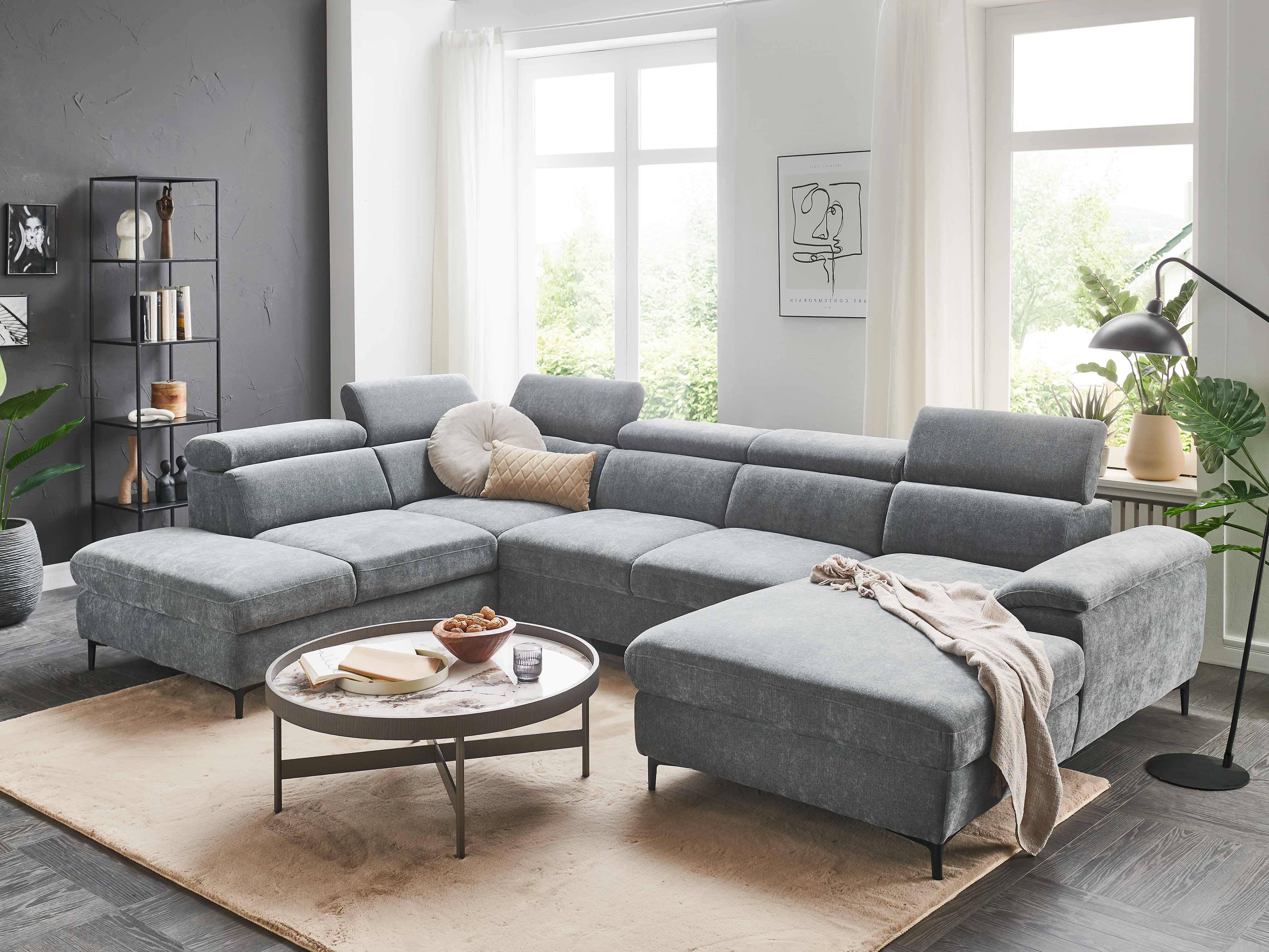 Ecksofa Kabs Polsterwelt mit grauem Stoffbezug, verstellbaren Kopfstützen und schwarzen Füßen