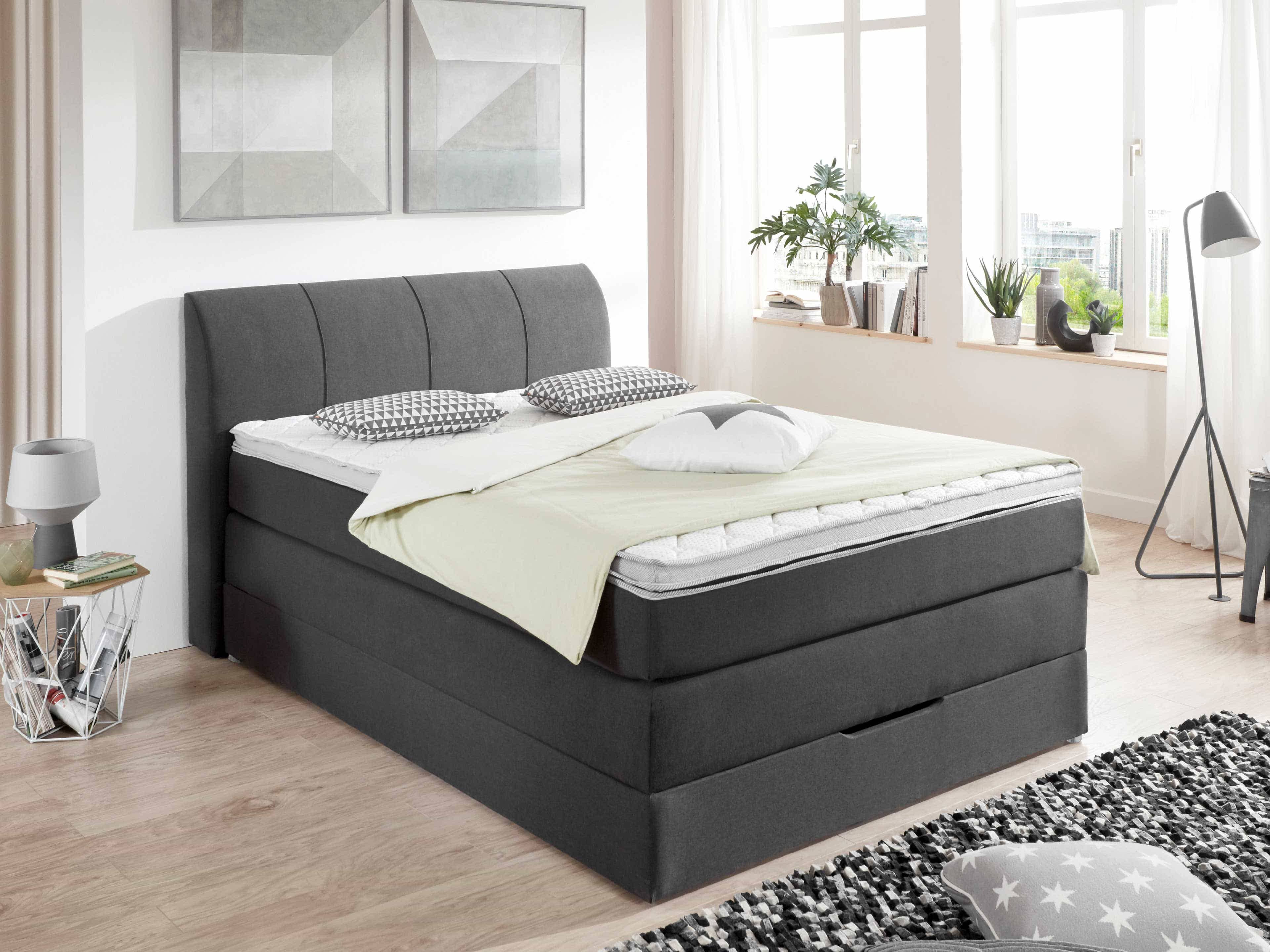 Boxspringbett Kabs mit gepolstertem, grauem Stoffbezug, hohem Kopfteil und geradem Design
