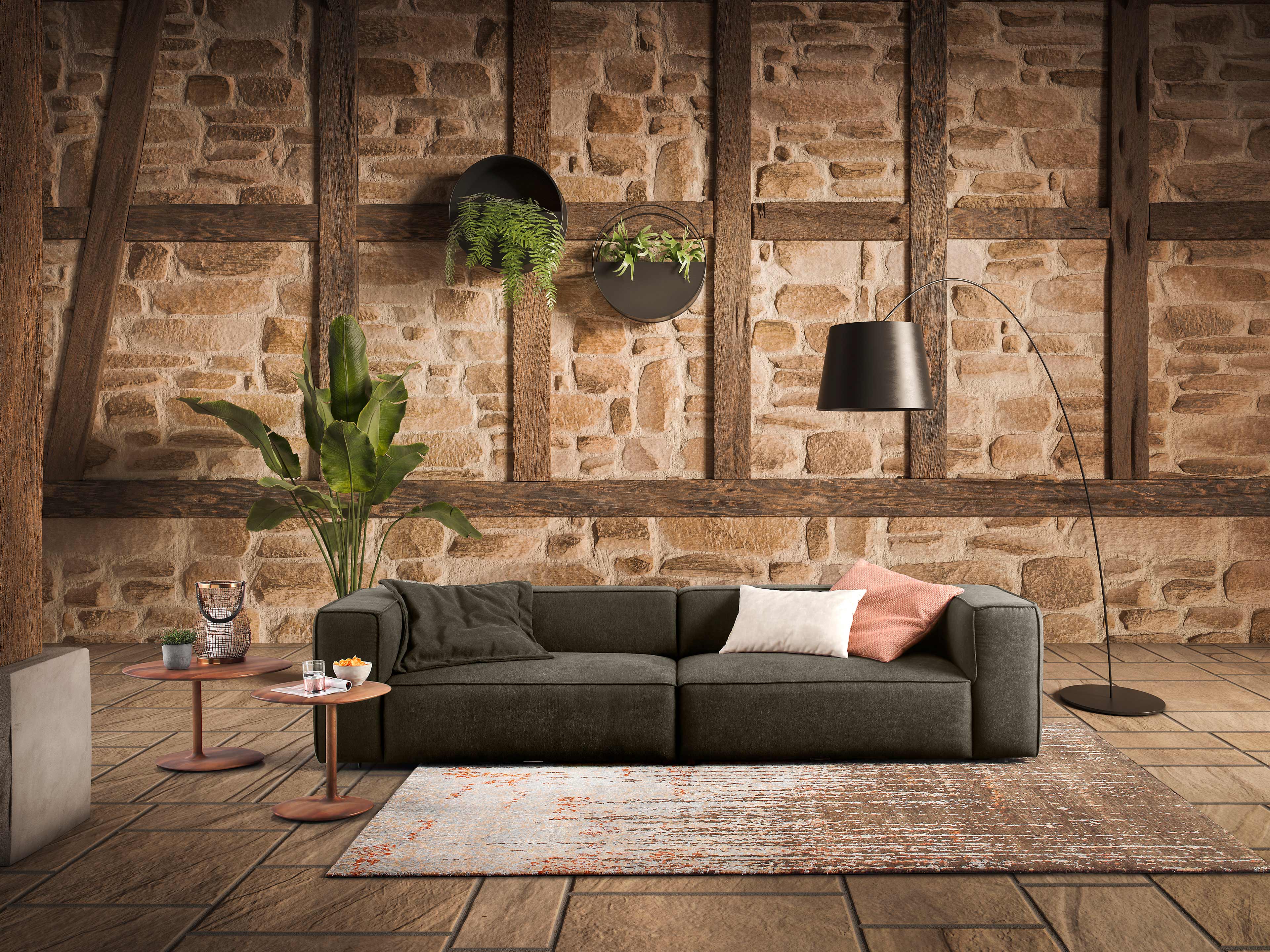 Ecksofa Modell mit dunkelgrauem Stoffbezug, breiten Armlehnen, sichtbarer moderner Polsterung