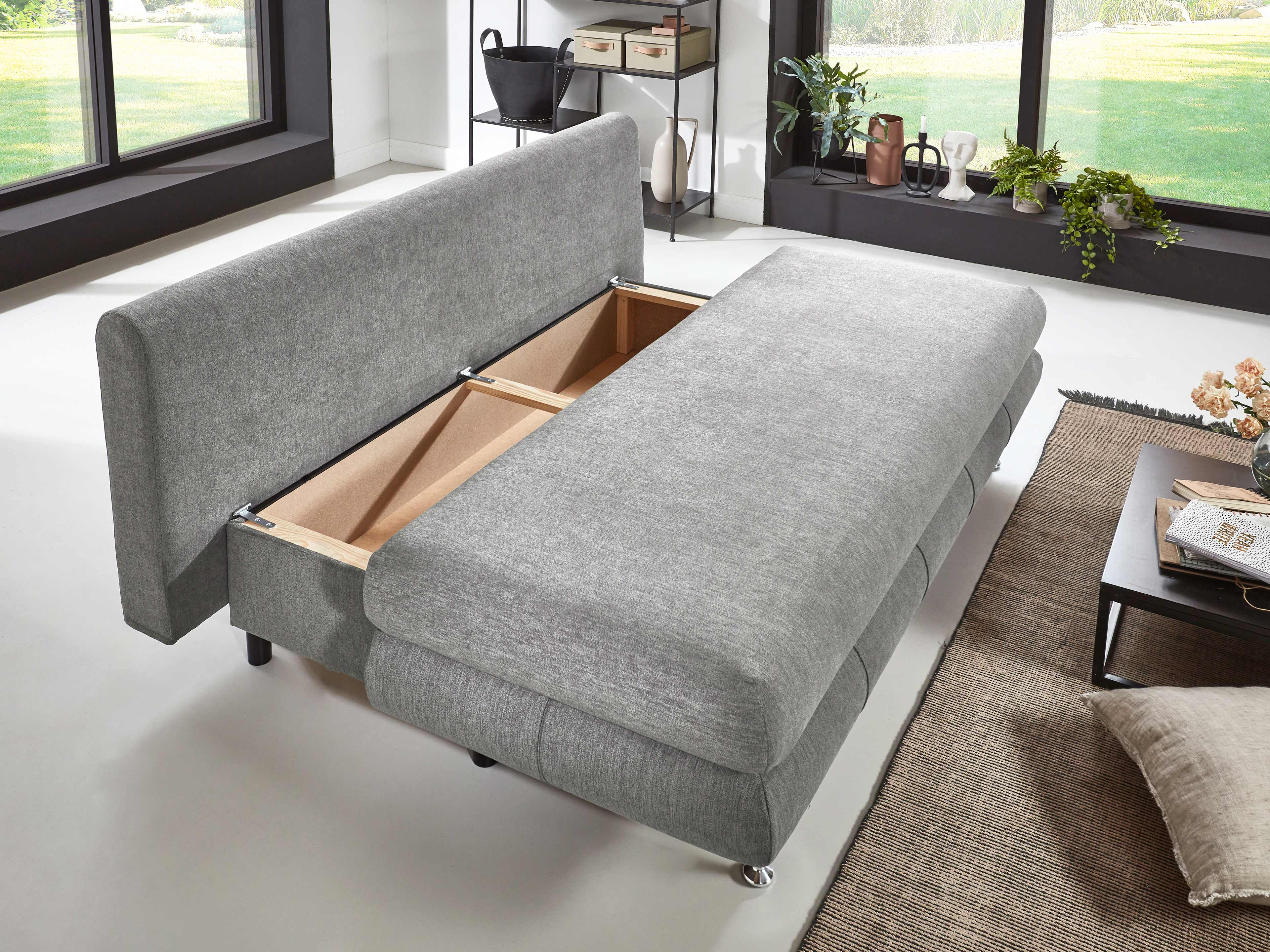 Schlafsofa mit grauem Stoffbezug, Bettkastenfunktion und gepolstertem Rücken in modernem Design