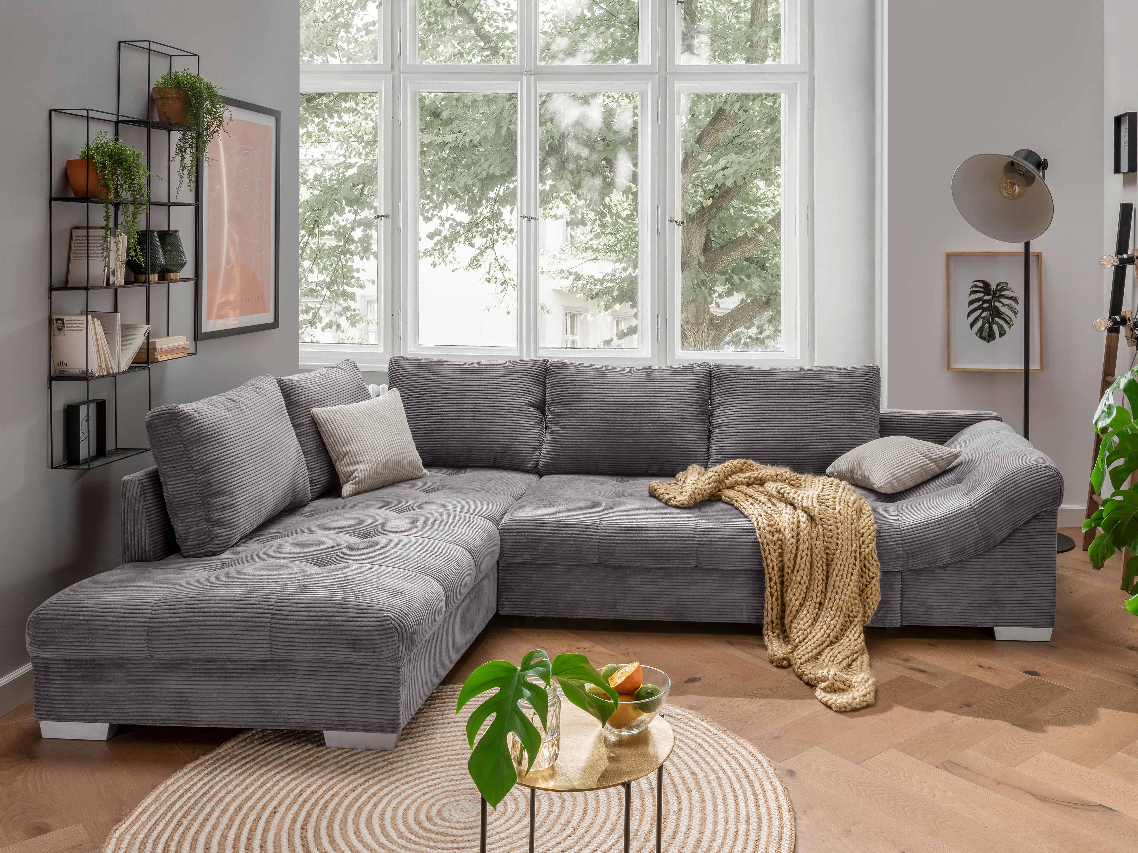 Ecksofa Kabs Polsterwelt mit grauem Cordbezug, gepolsterter Rückenlehne und breiten Armlehnen
