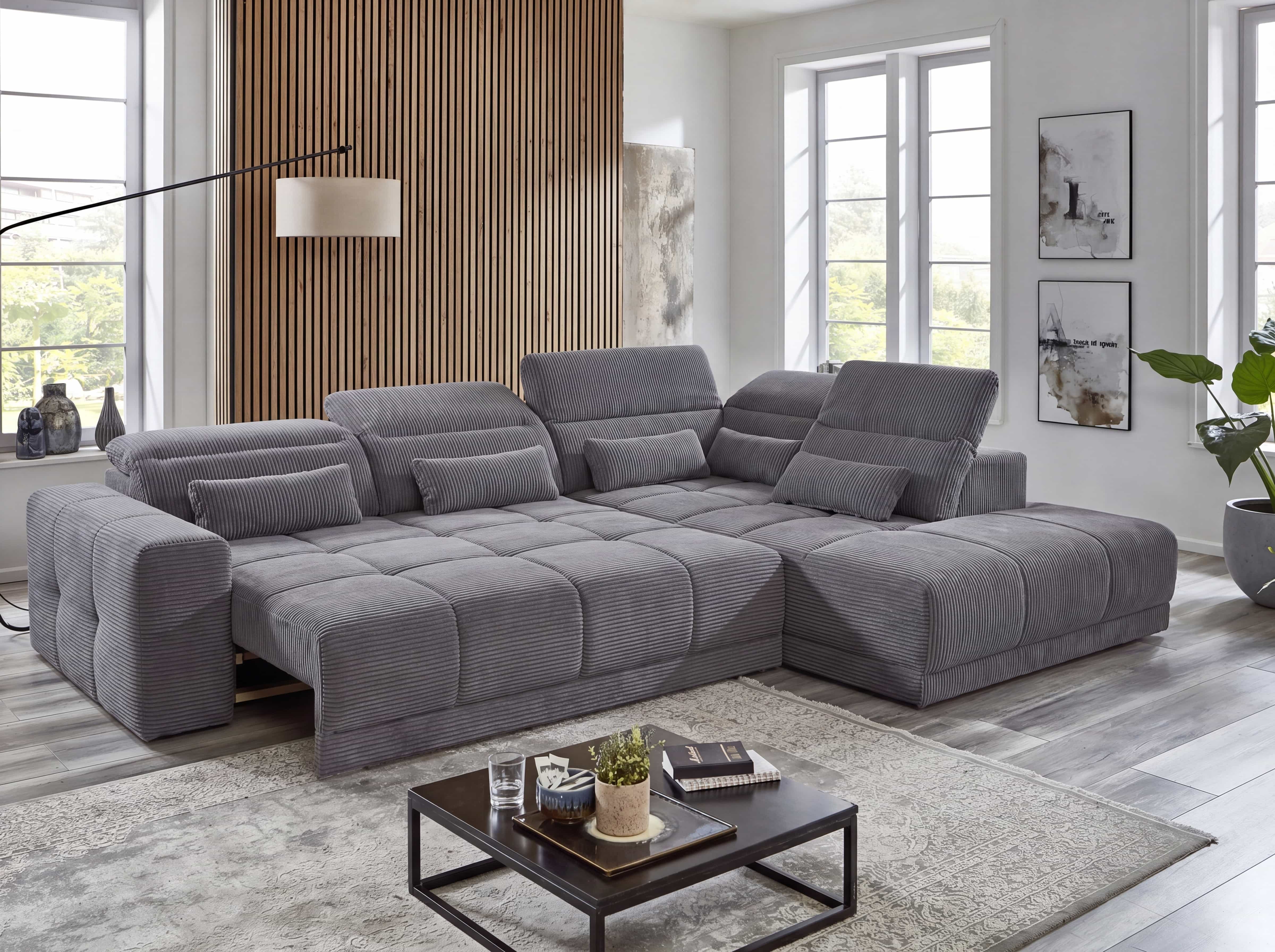 Ecksofa Kabs Polsterwelt mit grauem Cordbezug, gepolsterten Armlehnen und verstellbaren Kopfstützen