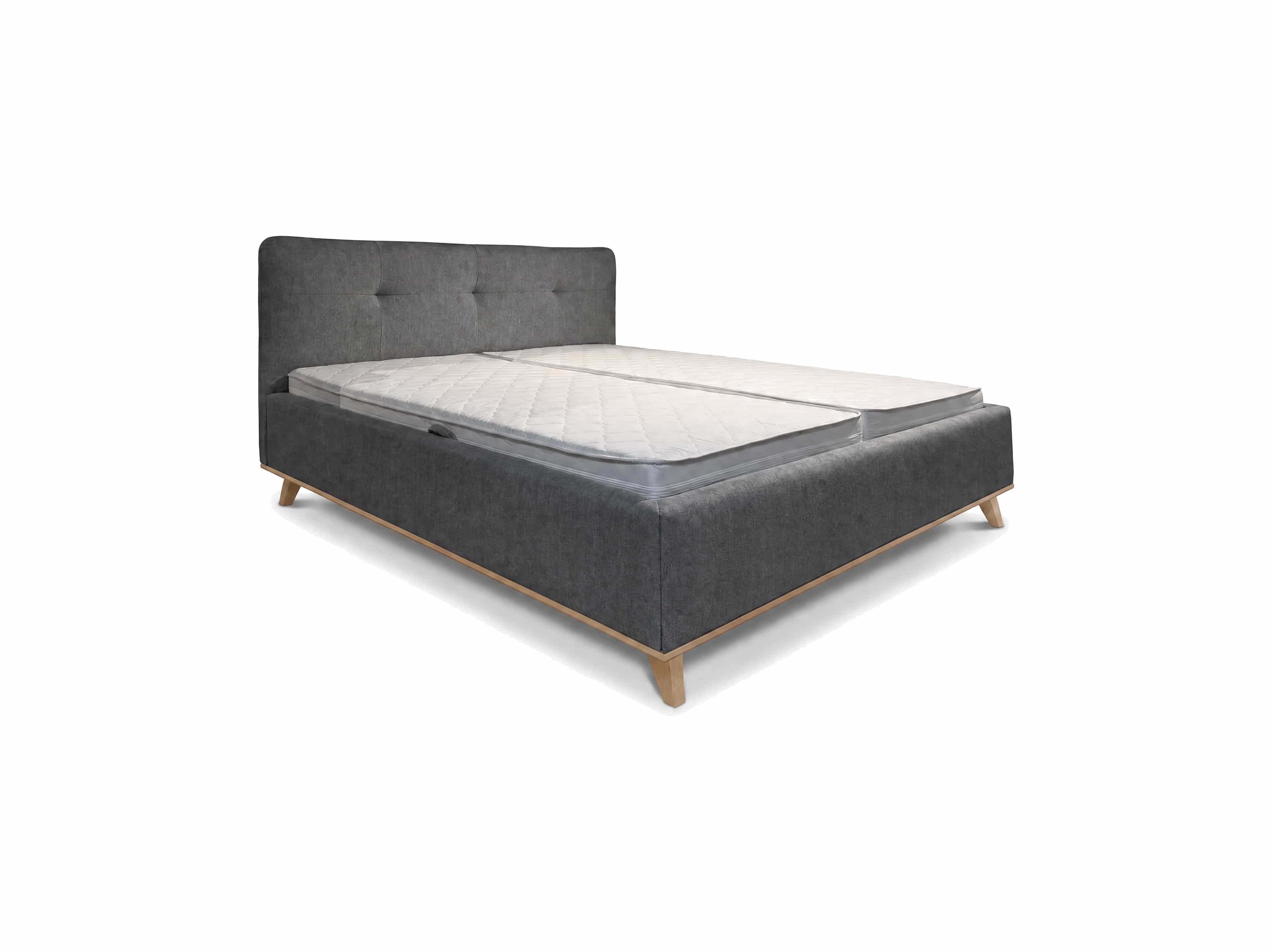 Boxspringbett mit grauem Stoffbezug, gestepptem Kopfteil und Holzfüßen in schräger Ausführung