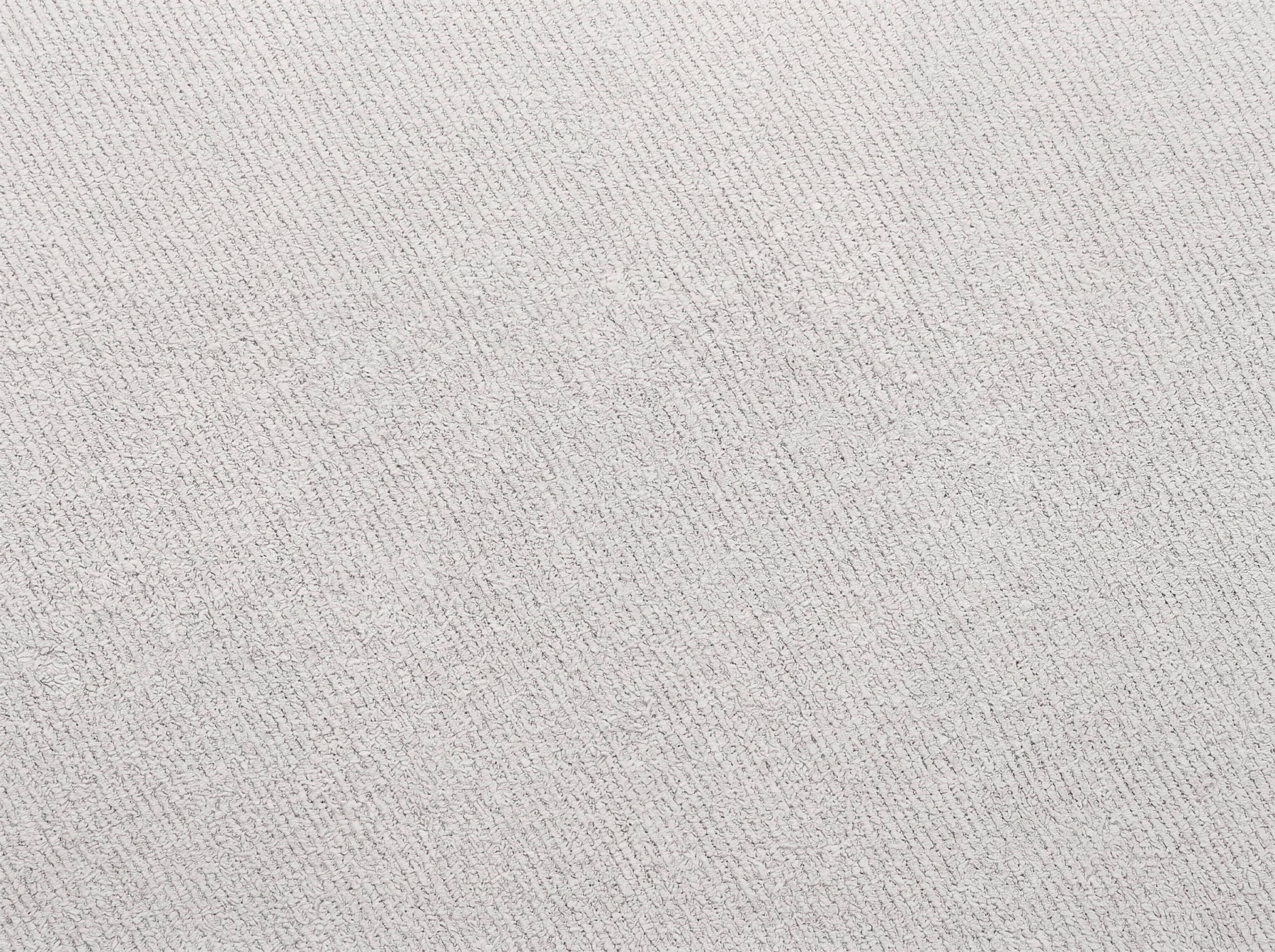 Helles Bezugsmaterial aus strukturiertem Stoff mit sichtbarer, feiner Webstruktur in Beige