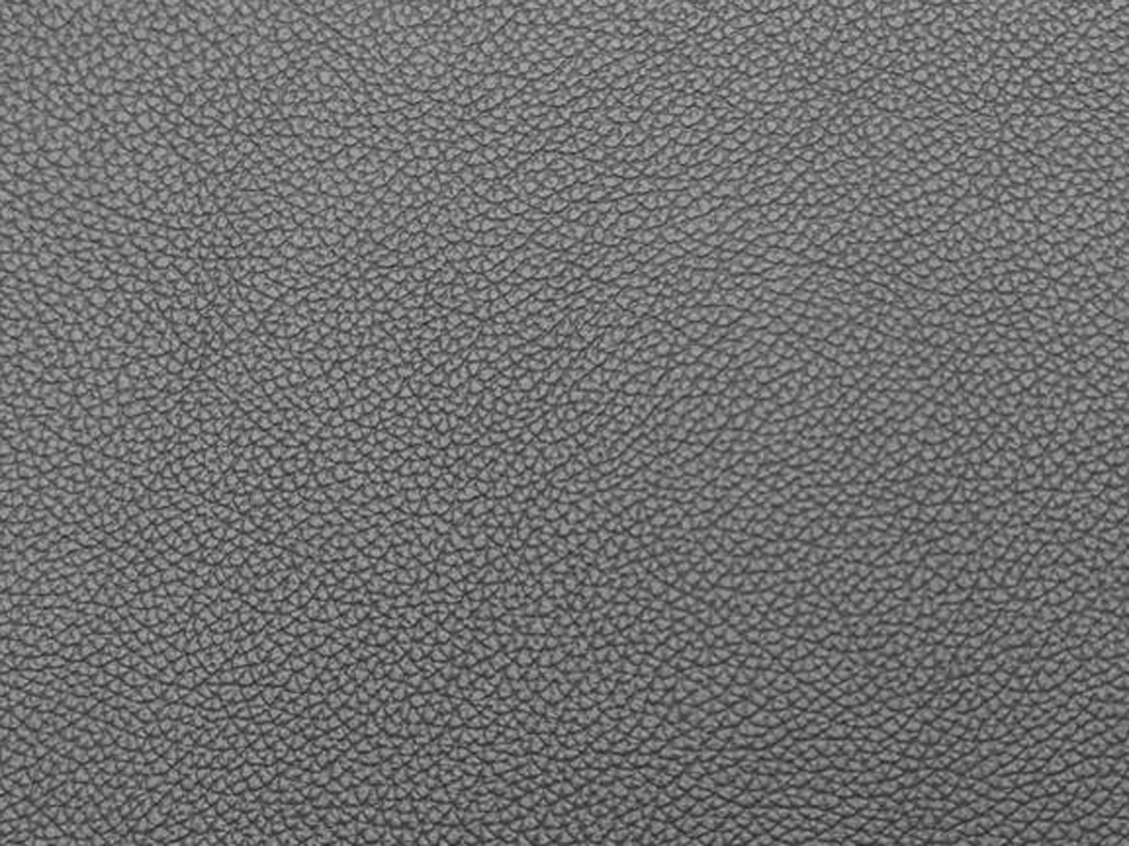 Graue Lederstruktur mit feiner Narbung, Nahaufnahme des Materials ohne weitere Details.