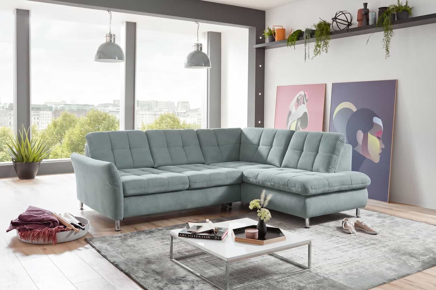 Ecksofa Kabs Polsterwelt mit hellblauem Stoffbezug, gepolsterter Rückenlehne und Metallfüßen