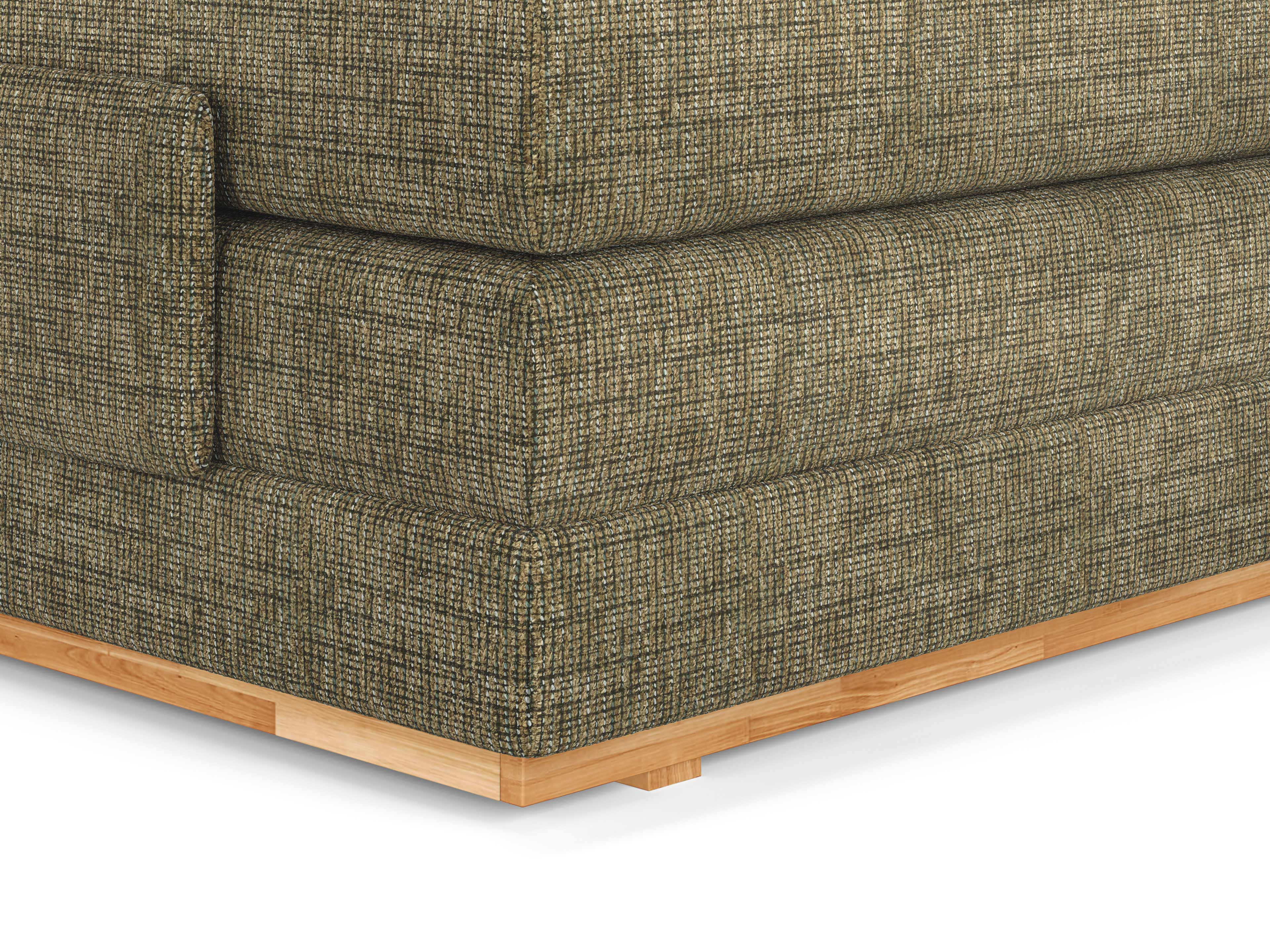 Boxspringbett Eckdetail mit olivgrünem Stoffbezug und sichtbarem Holzsockel in heller Holzoptik